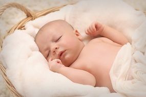 newborn in basket close up