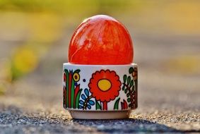 red easter egg in stand