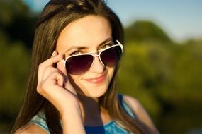 portrait of a young woman in sunglasses