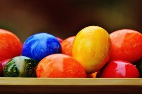 Closeup picture of bright colorful shiny Easter eggs
