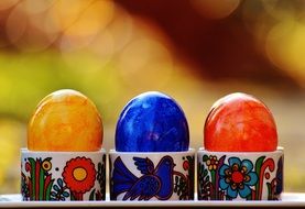 colorful shiny eggs in a stand