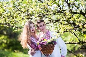 happy young couple in spring garden