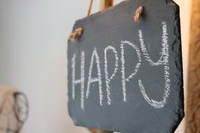 "Happy"text on chalkboard