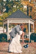 Couple is kissing on the wedding