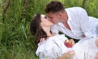 love couple kisses on nature