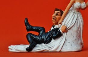 comic figure of the groom with the bride