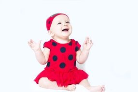 Baby in the red and black costume