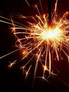 fire of sparkler on the black background