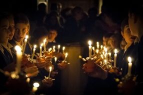 children with candles at Christmas