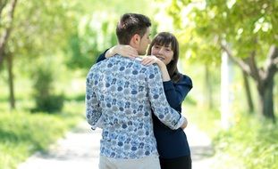 beautiful couple in love in the park on a sunny day