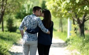 Couple is kissing in the park