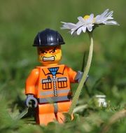 Lego figurine with a flower