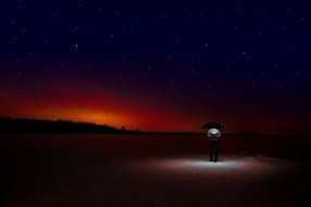 man under Umbrella at darkness on snow, artwork