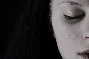 part of Girlâs face with closed eye
