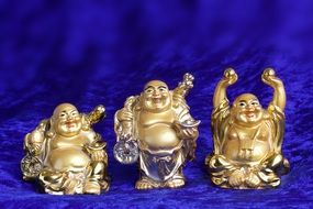 three figures of laughing buddha