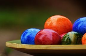 Easter eggs with a shiny shell on a plate