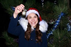 smiling girl near the new year tree