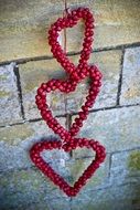 three red Hearts at stone wall, Valentineâs Day