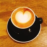 Cappuccino with milk foam in the shape of a heart