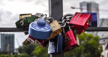 multi-colored metal locks on the bridge