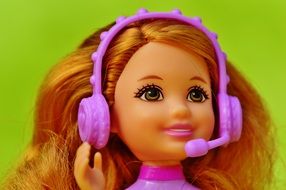 Barbie in headfones with microphone, toy portrait