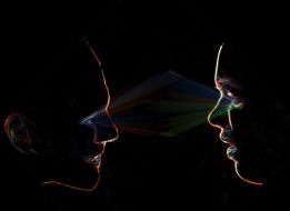 Pair looking at each other in a dark