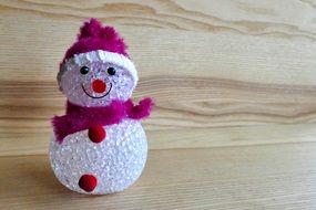 figure of a snowman in violet accessories
