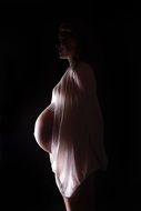 pregnant woman in the dark