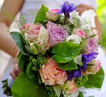 colorful bouquet in the hands of the bride