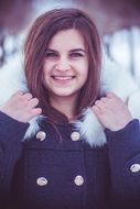 beautiful smiling girl in winter jacket