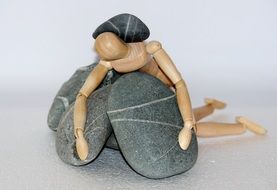 human figurine among stones as a symbol of life struggle