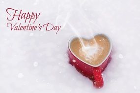 heart-shaped mug in snow