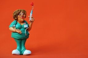 statuette of a nurse with a syringe
