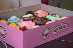 cardboard box with cupcakes