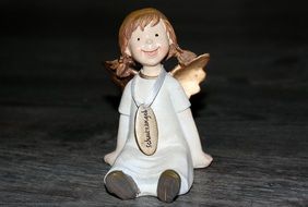 ceramic figure of a cheerful angel