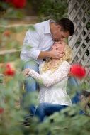 couple in love in a flowered garden