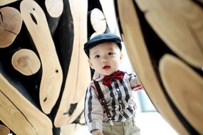 boy in a shirt and a red bow-tie