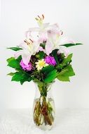 bouquet of different flowers in a glass vase