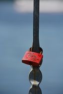 Love padlock on a metal fence