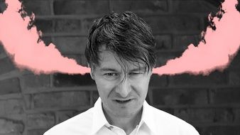 pink steam from the ears of a man