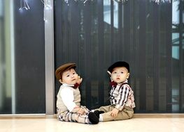 portrait of stylish cute twins