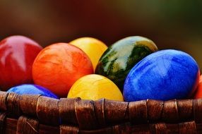 bright colorful shiny eggs in a basket