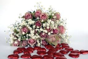 large bouquet of roses and a lot of red hearts