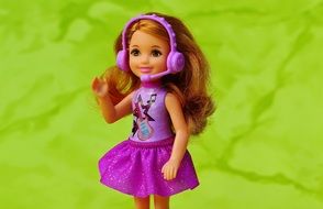 little doll with headphones with microphone