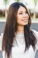 happy woman with long brown hair