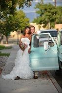 bride and groom near the truck