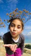 photo of a girl blowing a kiss