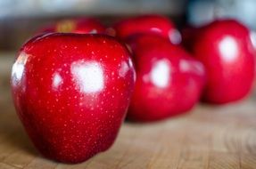 Red Apples on wooden table