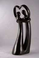 black sculpture of a couple in love