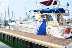 married couple near the yacht